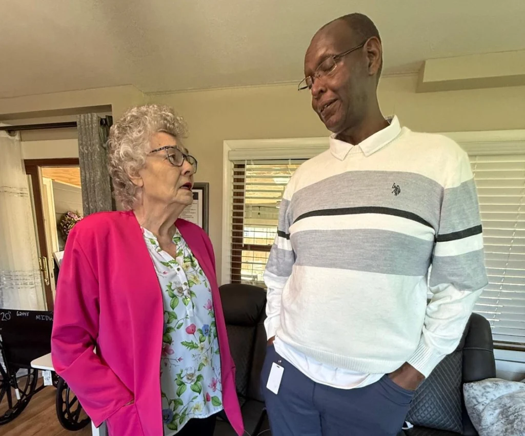 Caregiver And Senior Resident Having A Friendly Conversation In A Home Care Setting 1024x851