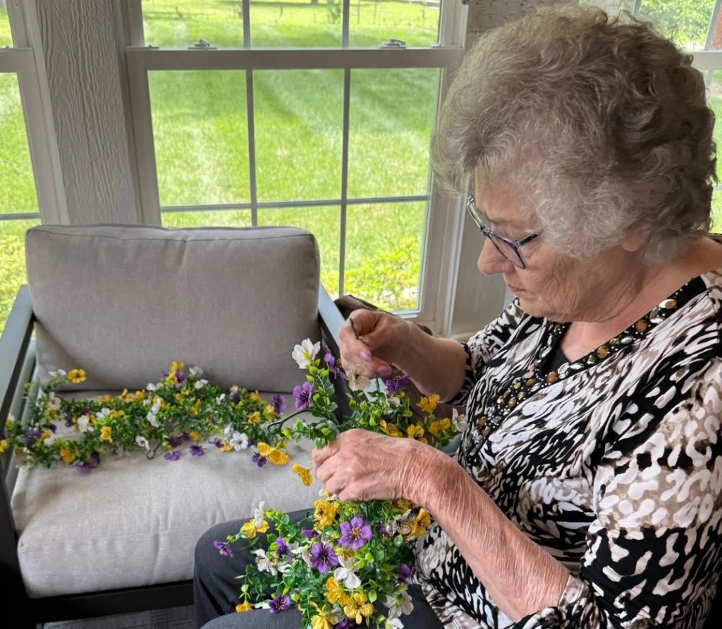 Senior Resident Creating Flower Crafts During An Arts And Crafts Activity 1024x893
